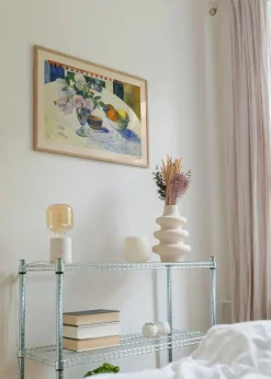 Flowers and a Bowl of Fruit on a Table